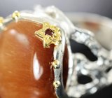 Серебряное кольцо с рутиловым кварцем и родолитами