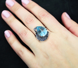 Серебряное кольцо с голубым топазом лазерной огранки 9,61 карата и синими сапфирами