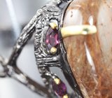 Серебряное кольцо с рутиловым кварцем и родолитами