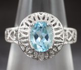 Ажурное серебряное кольцо с голубым топазом