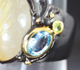 Серебряное кольцо с рутиловым кварцем, голубым топазом и перидотами