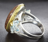 Серебряное кольцо с рутиловым кварцем и голубыми топазами