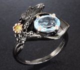 Серебряное кольцо с голубым топазом и перидотом