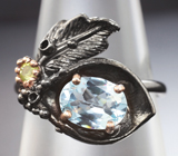 Серебряное кольцо с голубым топазом и перидотом