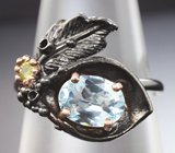 Серебряное кольцо с голубым топазом и перидотом