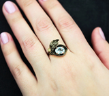 Серебряное кольцо с голубым топазом и перидотом Серебро 925
