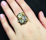 Серебряное кольцо с голубыми топазами и аметистами