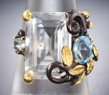 Серебряное кольцо с бесцветным кварцем, голубыми топазами и родолитом