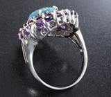 Серебряное кольцо с голубым топазом лазерной огранки, родолитами и уругвайскими аметистами