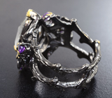 Серебряное кольцо с бесцветным кварцем, аметистами и родолитами