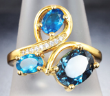 Эффектное серебряное кольцо с насыщенно-синим топазом и «неоновыми» апатитами Серебро 925