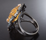 Серебряное кольцо с резным цитрином и голубыми топазами