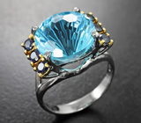 Серебряное кольцо с голубым топазом лазерной огранки 6,12 карата и синими сапфирами Серебро 925
