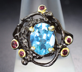 Серебряное кольцо с голубым топазом и альмандинами гранатами