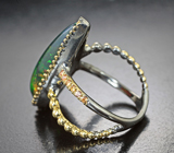 Серебряное кольцо с кристаллическим черным опалом 9,43 карата и сапфирами