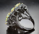 Серебряное кольцо с кристаллическими эфиопскими опалами и голубыми топазами