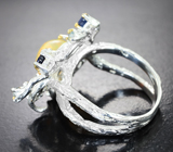 Серебряное кольцо с кристаллическим эфиопским опалом, синими сапфирами и голубыми топазами Серебро 925