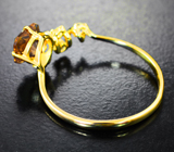Кольцо с орегонским солнечным камнем 1,27 карата и бесцветными цирконами Золото