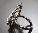 Серебряное кольцо с ограненным кварцем с рутилом 7,69 карата, иолитами и голубыми топазами Серебро 925