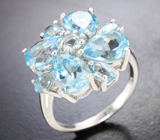 Эффектное серебряное кольцо с голубыми топазами