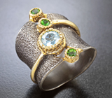 Серебряное кольцо с голубым топазом и диопсидами