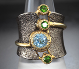 Серебряное кольцо с голубым топазом и диопсидами