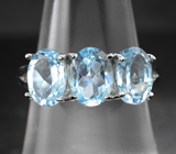 Стильное серебряное кольцо с голубыми топазами