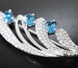 Изысканная серебряная брошь с голубыми топазами