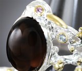 Скульптурное серебряное кольцо с дымчатым кварцем 8,19 карата и голубым топазом