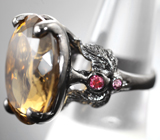 Серебряное кольцо с крупным цитрином 25,02 карата и родолитами