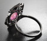 Серебряное кольцо с корундами и голубыми топазами