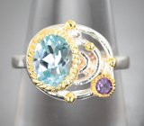 Серебряное кольцо с голубым топазом и аметистом