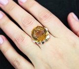 Серебряное кольцо с цитрином и голубыми топазами