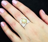 Серебряное кольцо с кристаллическим эфиопским опалом и родолитами
