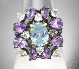 Серебряное кольцо с голубым топазом и аметистами