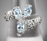 Ажурное серебряное кольцо с голубыми топазами