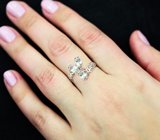 Ажурное серебряное кольцо с голубыми топазами