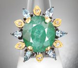Серебряное кольцо с крупным изумрудом 10,82 карата и голубыми топазами