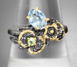 Серебряное кольцо с голубым топазом и перидотом