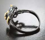 Серебряное кольцо с голубым топазом и перидотом