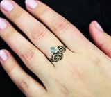 Серебряное кольцо с голубым топазом и перидотом