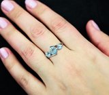 Эффектное серебряное кольцо с голубыми топазами Серебро 925