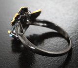 Серебряное кольцо с голубым топазом и перидотом