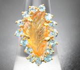 Серебряное кольцо с резным цитрином и голубыми топазами