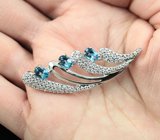 Изысканная серебряная брошь с голубыми топазами