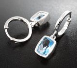 Стильные серебряные серьги с голубыми топазами